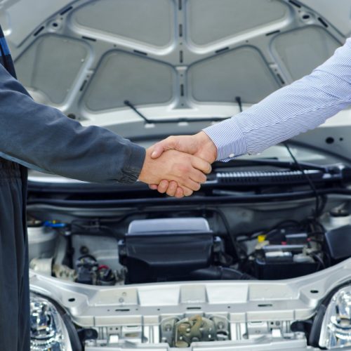 car-mechanic-and-customer-shaking-hands